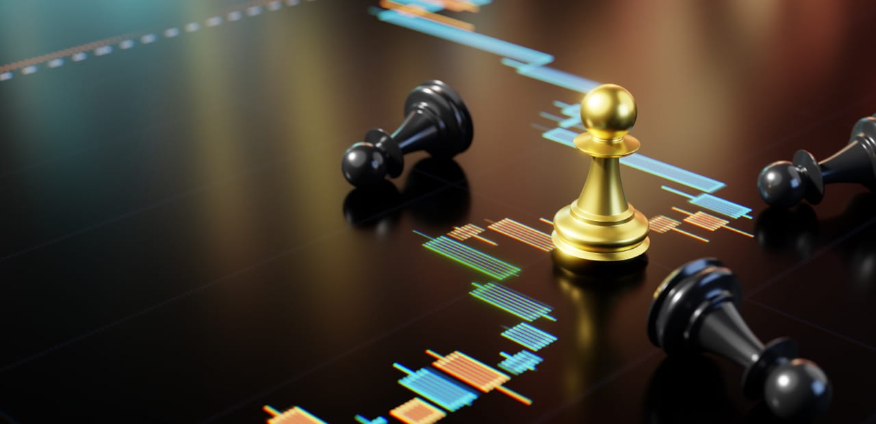 A gold pawn stands upright among fallen black chess pieces on a glossy surface displaying colorful financial charts.