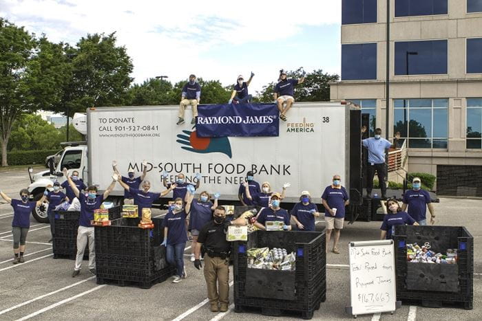 Raymond James associates and advisors practice social distancing while volunteering to load donations into the Mid-South Food Bank truck Raymond James associates and advisors practice social distancing while volunteering to load donations into the Mid-South Food Bank truck