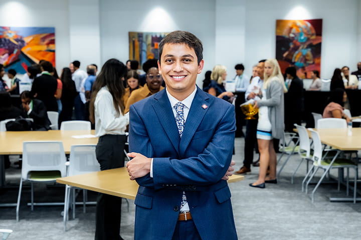 Navy Logo of Emerge Inclusion Network on light blue background